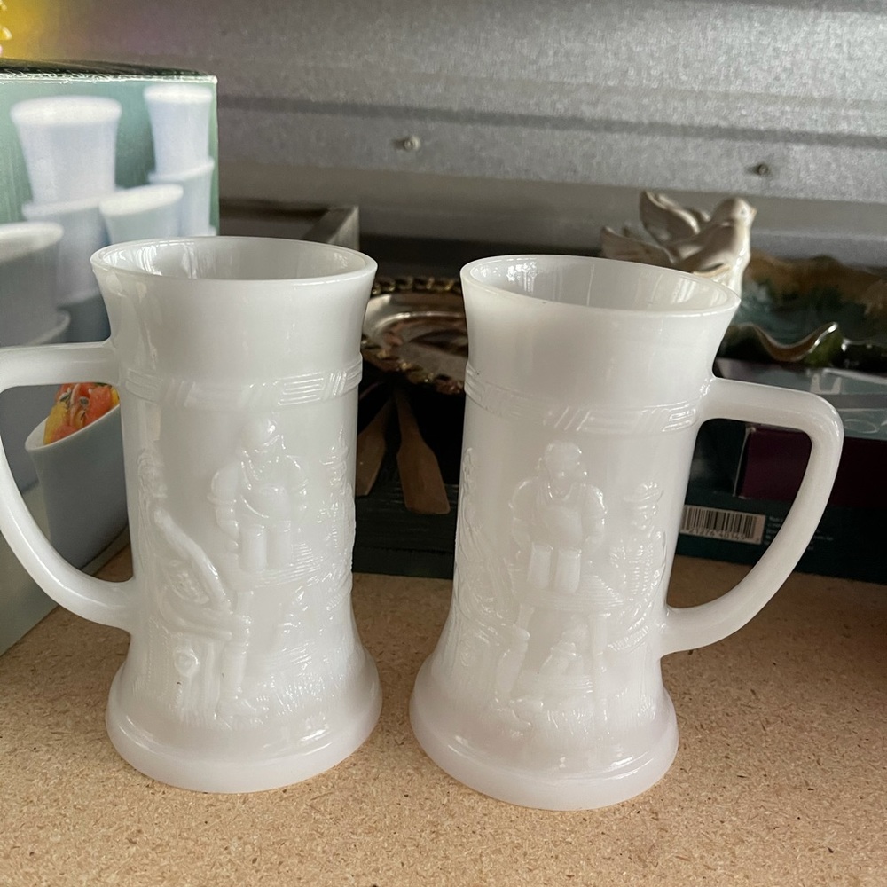 Two milk glass beer steins